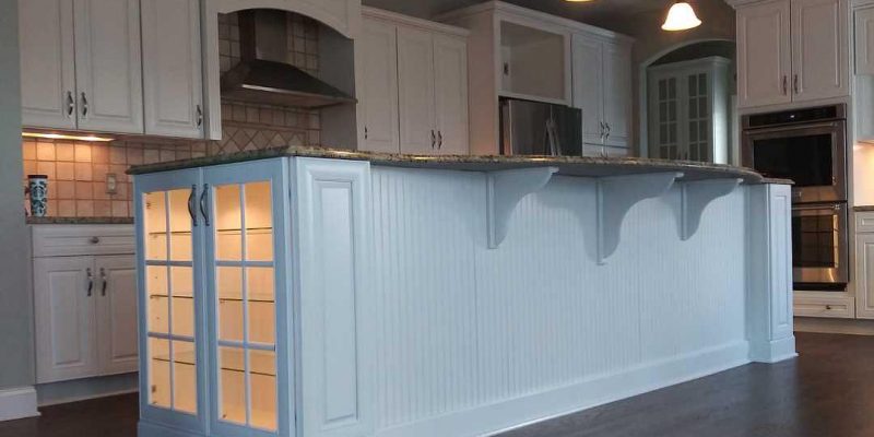 kitchen island painting with wainscot and corbels